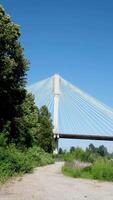 Port Mann Bridge over the Fraser River. Sunny Summer Surrey, Vancouver, British Columbia, Canada. shot of prohibited area from side mass of railway view from pipe and close-up approach against video