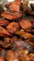 Grilling pork steaks, pork neck with the addition of herbs and spices on the grill plate, top view, 4k. Grilled meat, bbq, barbecue video