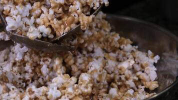 Cooking Popcorn popping on heated fry pan. Slow Motion. Making Popcorn Frying it in a Stove at Home. Exploding Popcorn Kernels over Hot Oil video