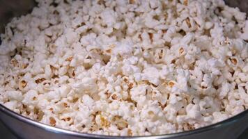 Cooking Popcorn popping on heated fry pan. Slow Motion. Making Popcorn Frying it in a Stove at Home. Exploding Popcorn Kernels over Hot Oil video