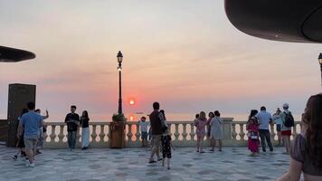 Vietnam Phu Quoc Island Grand World Starbucks 04.02.2024 Coffee cafe on the shores of the Indian Ocean near Kisses Bridge, the passage to bridge, sunset, people vacationing drinking coffee video