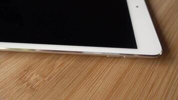 White Tablet or I pad Rotates video