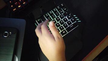 4k of the hand of a young person playing a game on the computer video