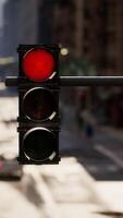 A red traffic light on a city street video