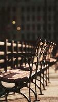 A row of wooden benches sitting next to each other video