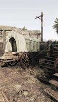 A rustic covered wagon on a dusty country road video