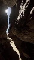 A narrow passage between two rocks in a cave video