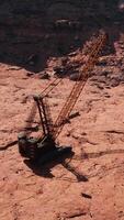 A crane is on the ground in the desert video