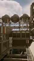 An industrial building with a concrete roof against a backdrop of the sky video