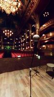 A large room with a piano and a chandelier video