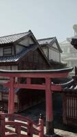 A red gate in front of a row of buildings video