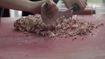 Adana Kebab Master Turns Lamb Meat into Minced Meat with an Armor Knife Footage. video