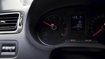 View inside of a passenger car with a dashboard. Action. Close up of engine speed scale with rising arrow, concept of transportation. video