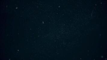 Night sky with many stars and flying particles. Stock footage. Bottom view of abstract nature background with stardust in deep universe. video