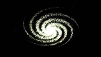 A spiral galaxy turning over a black background. Animation. Outer space view of a light green spirals of dust particles transforming into a cloud with a core in its center. video