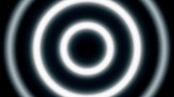 Hypnotic neon rings on black background. Animation. Looped animation with hypnotic effect of moving rings. Simple glowing circles move and hypnotize video