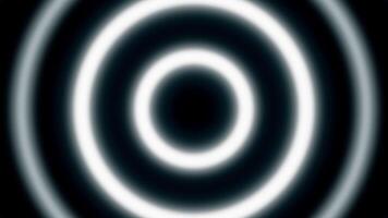 Hypnotic neon rings on black background. Animation. Looped animation with hypnotic effect of moving rings. Simple glowing circles move and hypnotize video