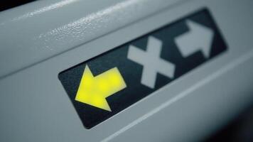 Close up of automatic turnstile details with pass and stop signs. . Red glowing cross is changed by green arrow. video