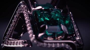 Close up of unusual shape pendant made of platinum, diamonds and giant emerald. . Luxury jewelry with gem stones isolated on black background. video