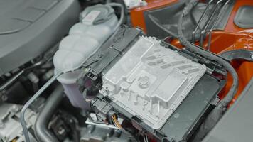 Close-up of inside of car under hood. Action. Powerful engine under hood of new car. Inside of new branded car video