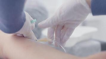 Close-up of nurse giving injection to patient. Action. Injection or drip to patient before operation. Nurse gives preventive injection to patient video