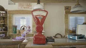 Vintage scales in old shop. Action. Beautiful and cozy shop in European hinterland. Shop with retro interior and things in old European town video