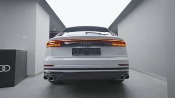 Germany, Berlin - March 2021. Rear view of new car at car dealership. Action. Stylish rear view design of new car. Exterior design of new automobile model from Audi company video