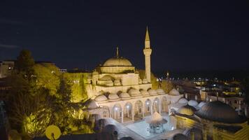 Turkey, Stambul, 08.01.2023 Mosque with lanterns at night. Action. Beautiful landscape of Turkish city with mosque illuminated by lanterns at night. Glowing mosque on background of Istanbul at night video