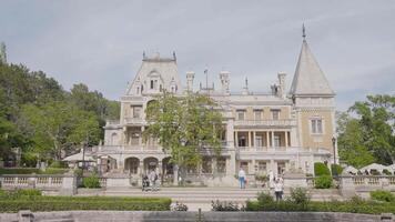 Facade of palace-museum in Crimea. Action. Beautiful historical palace with nature reserve in Crimea. Massandra Palace located on southern coast of Crimea video