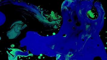 Fluid art on water. Footage. Beautiful streaks of colors with neon shades. Colors are mixed into patterns on surface of water video