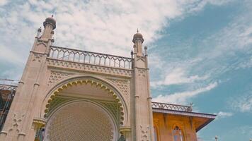 Vorontsov Palace. Action. Bottom view of facade of eastern or Muslim palace. Arched entrance with domes in oriental style on background of blue sky video