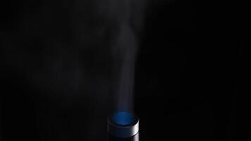 Steam from the ultrasonic humidifier isolated on a black background. Concept. Healthcare, climate change, extreme close up of an air humidifier nozzle. video