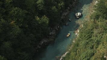 View from the height. Creative. View from the mountain on a small boat sailing along the forest on a narrow river. video