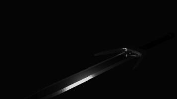 A medieval sword of silver color flying against black backdrop. Design. Game of light and shadow, concept of war or battle, sharp weapon in the dark, monochrome. video