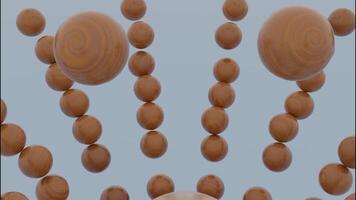 Close up of wooden brown sphere falling inside the falling apart figure of small balls. Design. Shape of balls destructing with a moving reverse effect. video