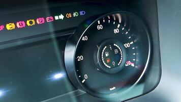 Car tachometer detail with increasing rpm value. Scene. Close up of modern panel board with burning indicators. video