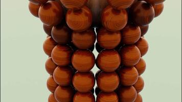 Close up of wooden brown sphere falling inside the falling apart figure of small balls. Design. Shape of balls destructing with a moving reverse effect. video