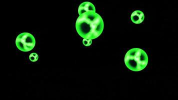 Abstract colorful transparent glowing spheres rotating isolated on a black background, seamless loop. Design. Neon glowing round shaped figures spinning endlessly. video