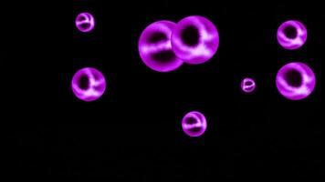abstrakt färgrik transparent lysande sfärer roterande isolerat på en svart bakgrund, sömlös slinga. design. neon lysande runda formad siffror spinning oändligt. video