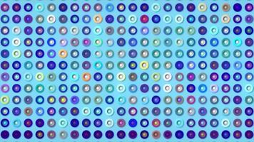 Multicolored dots with changing colors of rings. Motion. Background of many shimmering multicolored dots with rings. Dots flickering with different colors video