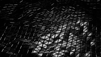 Contexte de Triangles brillant et en mouvement dans vagues. conception. futuriste surface de Triangles en mouvement vagues. cycle de vagues sur surface de triangulaire mosaïque video