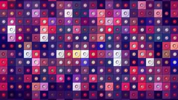 Mosaic background of shimmering colored squares with dots. Motion. Bright multicolored background of many squares changing colors. Shimmering multicolored squares with dots in disco style video