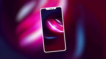 The phone is in abstraction. Motion. Bright pink background with shades of blue color in the foreground of the phone with the same screensaver as the background behind which is spinning video