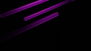 Black background. Design. Bright purple lines in 3d move across the background in abstraction. video