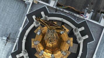 Norway, Stavanger, 08.01.2023 A drone view of a tower with golden domes at the bottom of which there are flags video