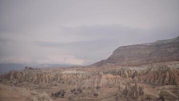 Top view of beautiful panorama of canyon. Action. Beautiful panorama of rocky canyon in cloudy weather. Rocky Valley on background of cloudy sky video