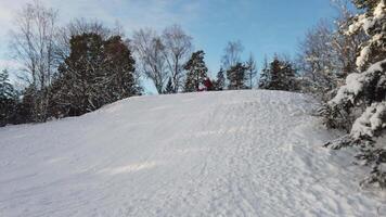 The sun has just risen in a cloudy sky over the snowy hill in Scandinavia video