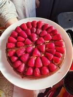 two strawberry cheesecakes are on a plate photo