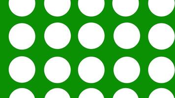 Abstract animation of a round white circle moving in a loop. Bagground pattern of round circles on a green background video