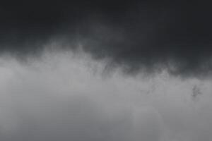 Cloudscape scenery, overcast weather above dark blue sky. Storm clouds floating in a rainy dull day with natural light. White and grey scenic environment background. Nature view. photo